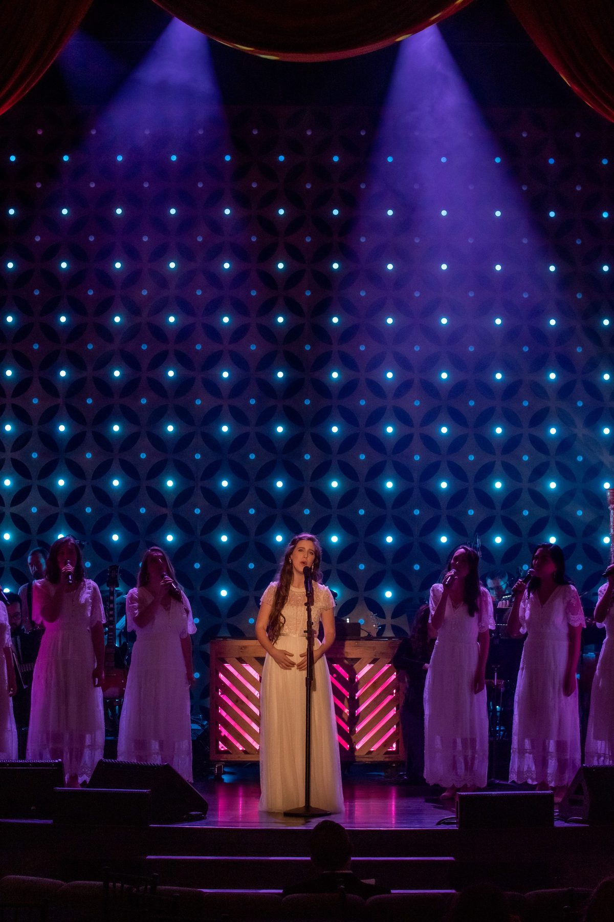 Gretchen Wolaver at the front of the stage