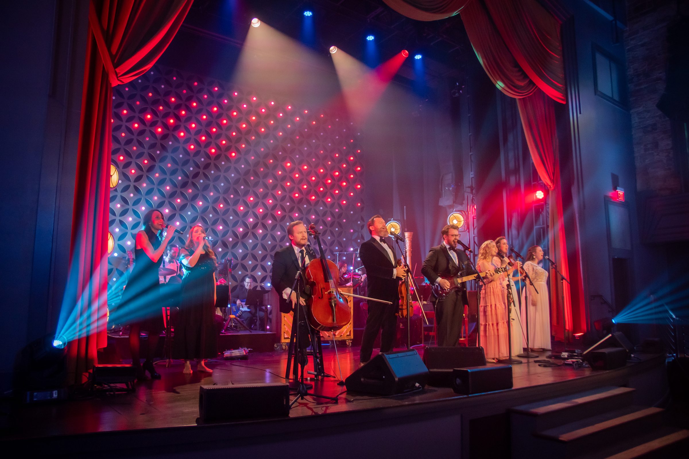 The Annie Moses Band in concert, red curtain and lights